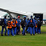 Parachutists boarding plane